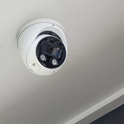 Dome CCTV camera mounted on an exterior wall